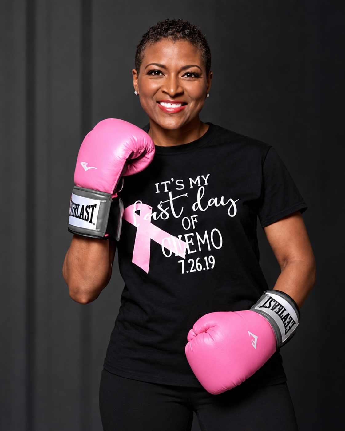 LaWanda Crawford wearing pink boxing gloves on her first day of chemotherapy